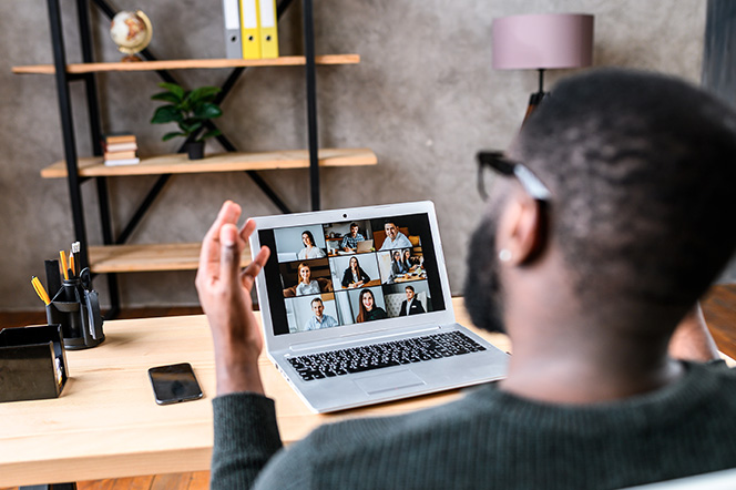 Young male taking a video conference call from home