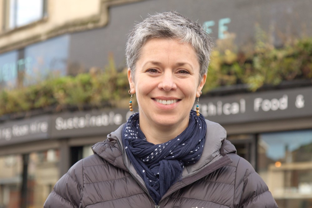 Photo shows woman in front of FutureLeap events space and café in Bristol